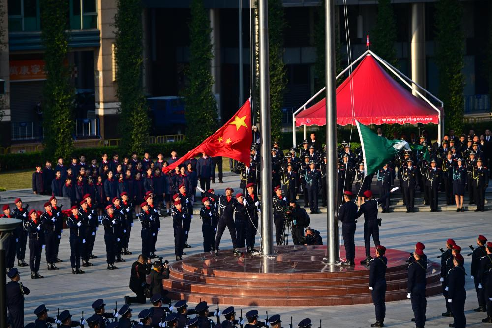 12月20日，澳門特別行政區(qū)政府隆重舉行升旗儀式，慶祝澳門回歸祖國25周年?！? title=
