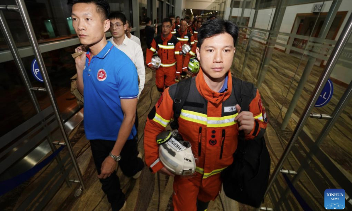Members of a rescue team from China's Hong Kong Special Administrative Region (HKSAR) government arrive in Yangon, Myanmar, March 29, 2025. The HKSAR government sent a 51-strong search and rescue team to earthquake-stricken areas in Myanmar on Saturday to assist in the search and rescue work. (Photo by Wang Shen/Xinhua)